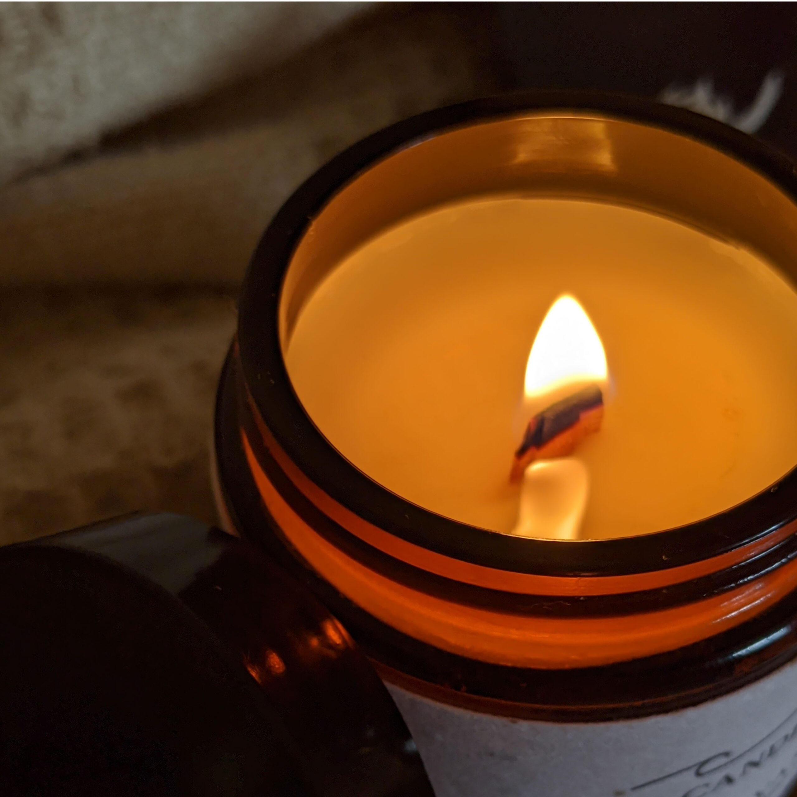 The Candle Brand Burn and Bloom candle burning close up