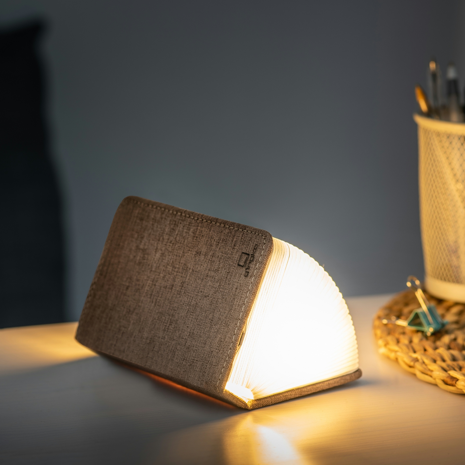 Gingko smart mini book light in coffee part opened on table