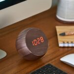 Gingko Tumbler Click Clock Walnut fromt on desk