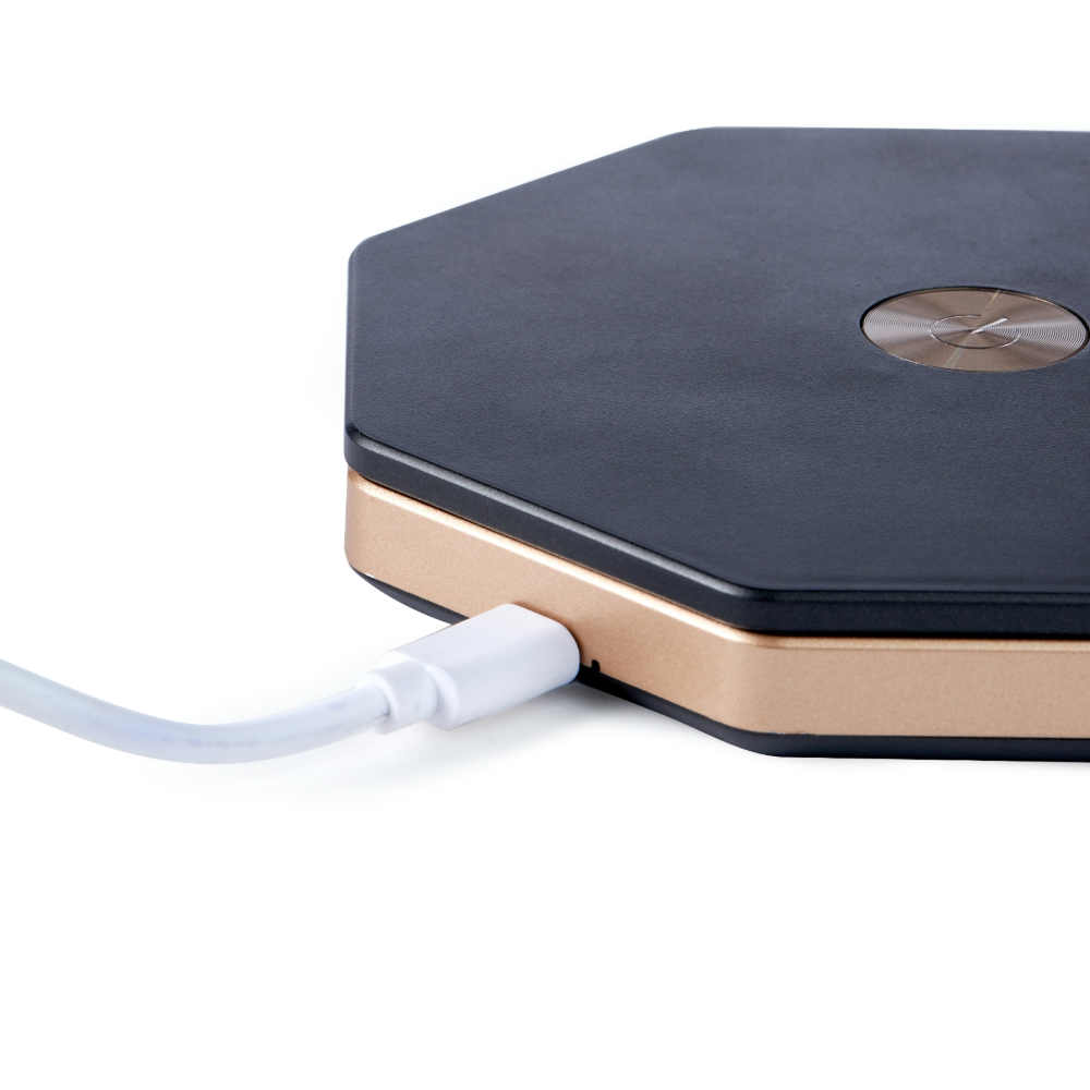 Gingko Hexagon Twist Light Black plugged in Gingko Hexagon Twist Light Black showing charging cable